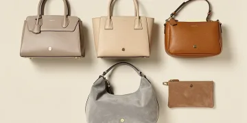 Five quiet luxury handbags with high resale value arranged elegantly on a clean surface.